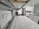 Modern kitchen features white cabinets, quartz countertops, and stylish backsplash at 37570 Teri Ct, Dade City, FL 33525
