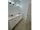 Double vanity bathroom with modern finishes and a spacious layout at 37570 Teri Ct, Dade City, FL 33525