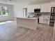 Modern kitchen with white cabinets and an island at 37570 Teri Ct, Dade City, FL 33525