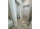 Small bathroom with toilet and access to a walk-in closet at 37570 Teri Ct, Dade City, FL 33525