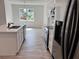 Modern kitchen with island, stainless steel appliances, and hardwood flooring at 37570 Teri Ct, Dade City, FL 33525