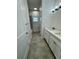 Modern bathroom with double vanity, bathtub and patterned tile at 37570 Teri Ct, Dade City, FL 33525