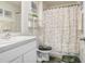 Clean bathroom with white vanity and shower/tub combo at 5420 Salt Plains Ct, Wimauma, FL 33598