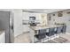 Modern kitchen with granite countertops and a breakfast bar at 5420 Salt Plains Ct, Wimauma, FL 33598