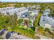 Aerial view of a modern home with a rooftop deck, a mural, landscaping, and palm trees at 103 5Th N Ave, St Petersburg, FL 33701