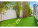 An outdoor putting green with white fence and bamboo at 103 5Th N Ave, St Petersburg, FL 33701