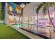 Stunning backyard pool with ample patio space, complemented by a vibrant mural and outdoor lounge area at 103 5Th N Ave, St Petersburg, FL 33701