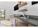 Stylish bar area featuring a beverage cooler, floating shelves, and modern finishes for entertaining at 103 5Th N Ave, St Petersburg, FL 33701