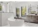 Elegant bathroom featuring a freestanding tub, modern fixtures, and bright windows, creating a relaxing oasis at 103 5Th N Ave, St Petersburg, FL 33701
