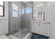 Modern bathroom featuring a glass-enclosed shower and stylish gray tile at 103 5Th N Ave, St Petersburg, FL 33701