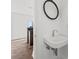 Modern bathroom with hardwood floors and a sink with chrome faucet at 103 5Th N Ave, St Petersburg, FL 33701