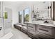 Bright bathroom features marble countertop vanity, modern fixtures, and ample natural light for a fresh and airy feel at 103 5Th N Ave, St Petersburg, FL 33701