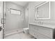 Modern bathroom showcasing a glass enclosed shower and sleek vanity with bright, overhead lighting at 103 5Th N Ave, St Petersburg, FL 33701