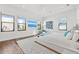Airy bedroom with multiple windows, contemporary art, fan and stylish decor creating a comfortable and modern ambiance at 103 5Th N Ave, St Petersburg, FL 33701