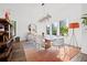 Bright dining room featuring stylish lighting, hardwood floors, and windows with views at 103 5Th N Ave, St Petersburg, FL 33701