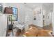 Cozy hallway with a stylish lounge chair, hardwood floors, and artful wall decor at 103 5Th N Ave, St Petersburg, FL 33701
