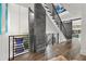 Spacious hallway featuring modern railings, hardwood floors, stone accents and a sliding barn door at 103 5Th N Ave, St Petersburg, FL 33701