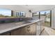 Modern kitchen features stainless steel sink, sleek countertops, and views of the city skyline at 103 5Th N Ave, St Petersburg, FL 33701