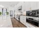 Well-equipped kitchen with stainless steel appliances, custom cabinetry, and marble countertops at 103 5Th N Ave, St Petersburg, FL 33701