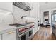 Modern kitchen features a gas range, marble backsplash, stainless steel appliances, and open concept design at 103 5Th N Ave, St Petersburg, FL 33701