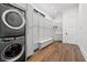 Functional laundry room with modern appliances, ample storage, and hardwood flooring at 103 5Th N Ave, St Petersburg, FL 33701