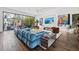 Open concept living room with unique art, stylish furniture, and plenty of natural light at 103 5Th N Ave, St Petersburg, FL 33701