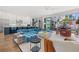 Expansive living area with an open floor plan, modern kitchen, and access to outdoor spaces at 103 5Th N Ave, St Petersburg, FL 33701