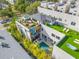 Aerial view of a modern home with a rooftop deck, a pool, and a mural at 103 5Th N Ave, St Petersburg, FL 33701