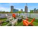 Rooftop deck featuring outdoor seating, a fire pit, and city views, perfect for entertaining at 103 5Th N Ave, St Petersburg, FL 33701