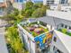 Aerial view of a modern home with a rooftop deck and a mural at 103 5Th N Ave, St Petersburg, FL 33701