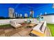 Spacious rooftop deck with comfortable lounge seating and stylish wood flooring, offering city views at 103 5Th N Ave, St Petersburg, FL 33701