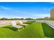 A relaxing rooftop deck, complete with lounge chairs and artificial turf at 103 5Th N Ave, St Petersburg, FL 33701