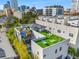 Aerial view of a modern home with a rooftop deck, a mural, and turf at 103 5Th N Ave, St Petersburg, FL 33701