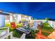 Relaxing rooftop deck featuring a modern fire pit, comfortable seating, and artificial turf for a cozy ambiance at 103 5Th N Ave, St Petersburg, FL 33701