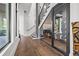 Staircase featuring dark wood floors, glass-enclosed wine cellar and natural light at 103 5Th N Ave, St Petersburg, FL 33701