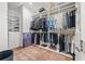 Well-organized walk-in closet with custom shelving and hanging racks, maximizing storage space and functionality at 103 5Th N Ave, St Petersburg, FL 33701