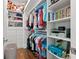 Well-organized walk-in closet with multiple shelves, drawers, and hanging space at 103 5Th N Ave, St Petersburg, FL 33701