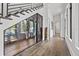 Under-stair enclosed wine cellar with glass door and hardwood floors at 103 5Th N Ave, St Petersburg, FL 33701