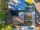 Bird's eye view displays roof, yard, nearby houses, fence, and trees at 1318 Preston S St, St Petersburg, FL 33712