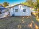 A/C unit on the side of the house with fenced backyard and nearby carport at 1318 Preston S St, St Petersburg, FL 33712