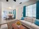 Inviting living room showcasing a dining area, a comfortable couch, and abundant natural light at 1318 Preston S St, St Petersburg, FL 33712