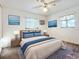 Comfortable bedroom with a plush bed, scenic artwork, and ample natural light streaming through windows at 1318 Preston S St, St Petersburg, FL 33712