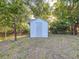 A white shed sits in the backyard, providing extra storage space at 1318 Preston S St, St Petersburg, FL 33712