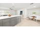 Modern kitchen with gray cabinets, quartz countertops, and an island at 1114 La Salle St, Clearwater, FL 33755