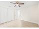 Spacious bedroom with double-door closet and ceiling fan at 1114 La Salle St, Clearwater, FL 33755