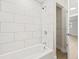 Updated bathroom with white subway tile and a new bathtub at 1114 La Salle St, Clearwater, FL 33755