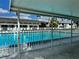 Community pool with covered seating and a relaxing atmosphere at 304 46Th Avenue W Ter # 218, Bradenton, FL 34207
