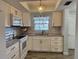 Updated kitchen with white cabinets and granite countertops at 304 46Th Avenue W Ter # 218, Bradenton, FL 34207