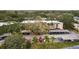 Aerial view of the building and surrounding landscape at 870 Virginia St # 112, Dunedin, FL 34698