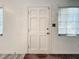 Simple entry door with six panels and light-colored wood trim at 1318 Preston S St, St Petersburg, FL 33712